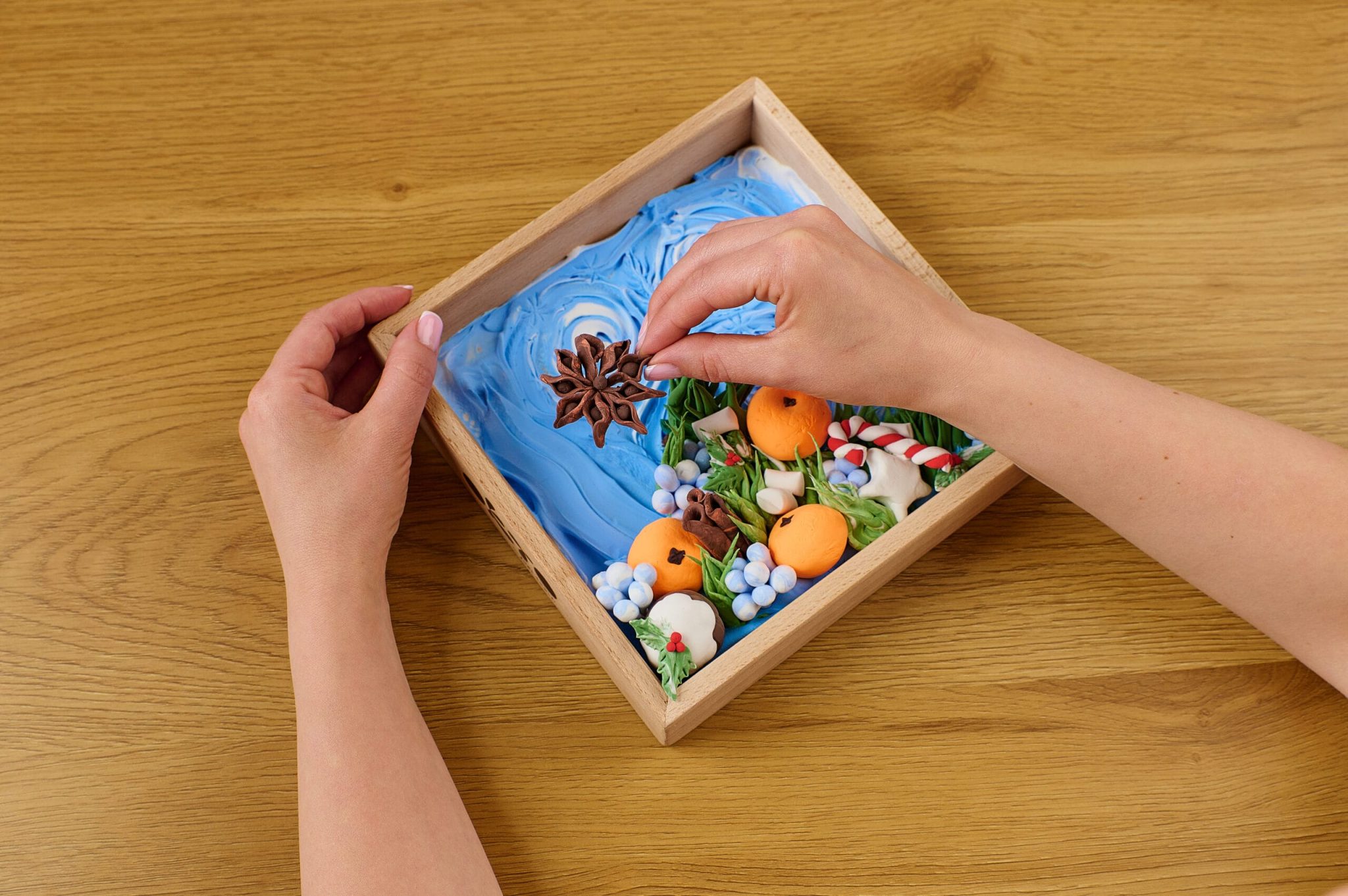 Place the details in the wooden base and optionally coat with varnish.